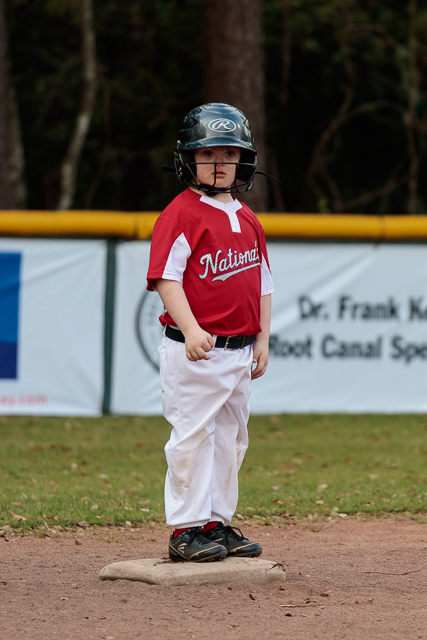 Nathan standing on second base waiting to run