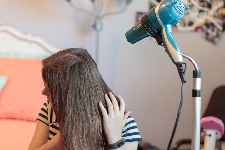 A hair dryer stand can help someone with cerebral palsy dry hair.