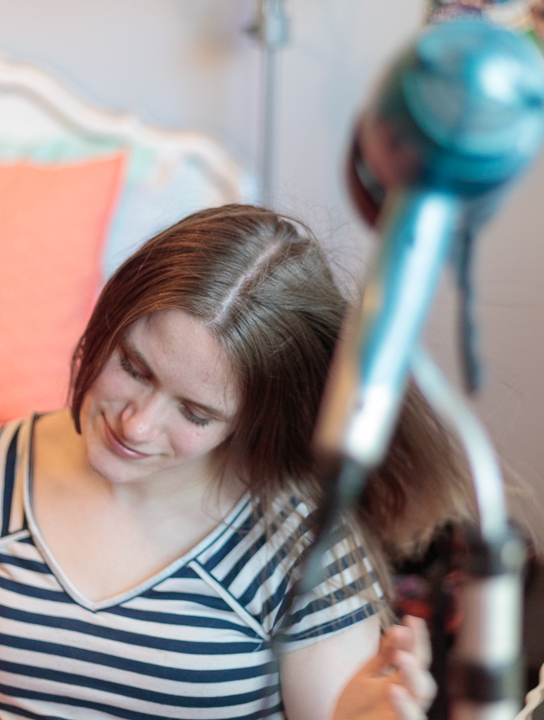 A hair dryer stand can help someone with cerebral palsy dry hair.